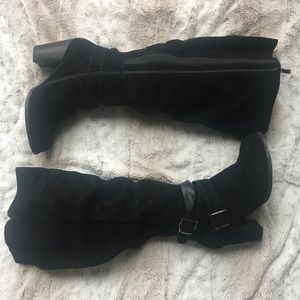 Knee high suede boots.